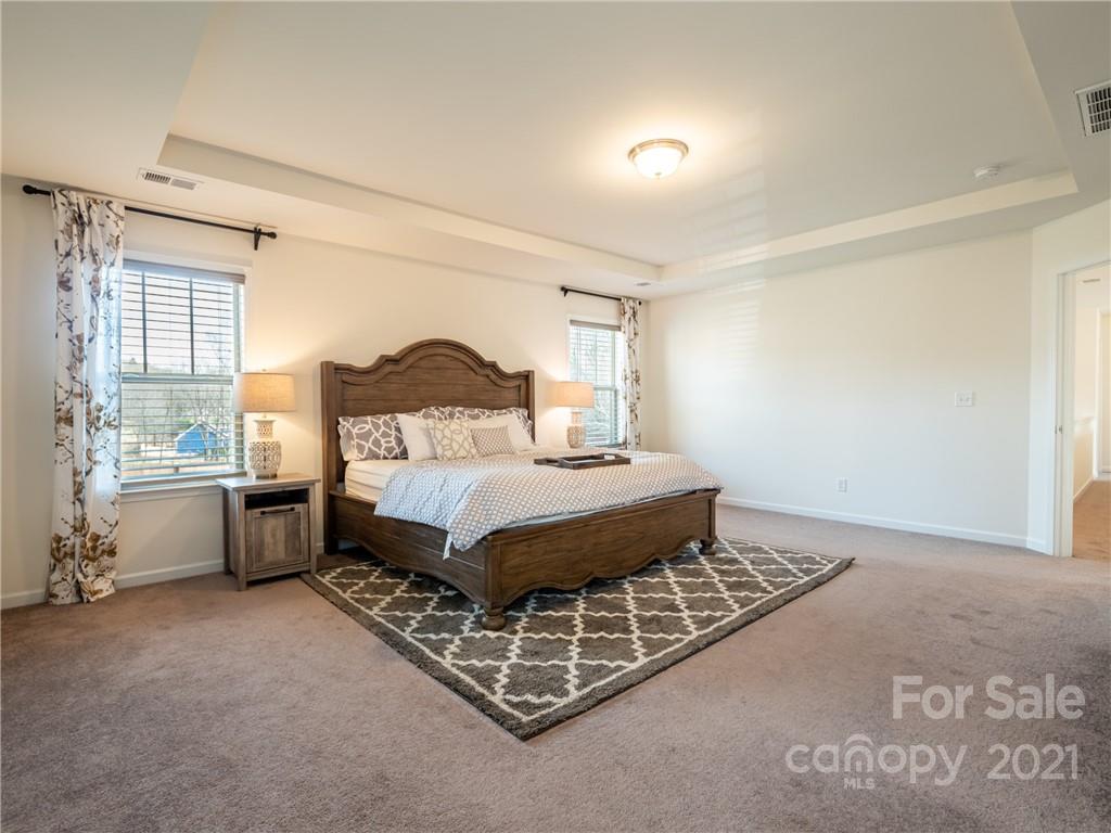 3 Henbit Way Arden, NC 28704 - Photo 32 of 46 a bedroom with a bed chair and window