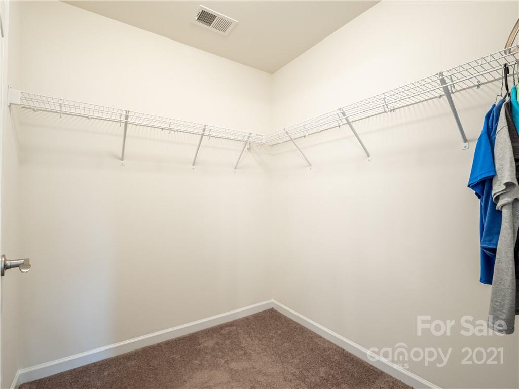 3 Henbit Way Arden, NC 28704 - Photo 35 of 46 a view of a room with racks on the wall