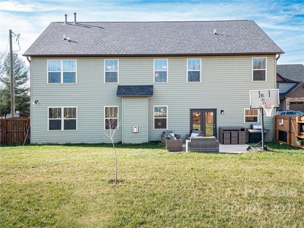 3 Henbit Way Arden, NC 28704 - Photo 46 of 46 a backyard of a house with yard and seating space