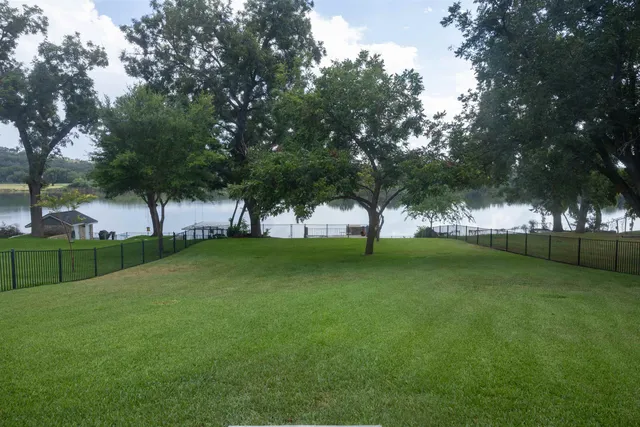 a view of field with tall trees