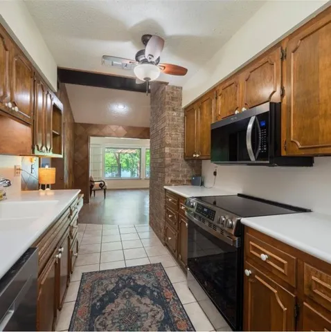 a front view of a house with a garden and yard