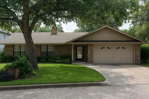 a living room with furniture a rug and a floor to ceiling window