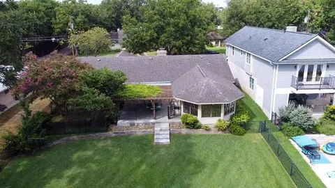 a view of green field with trees