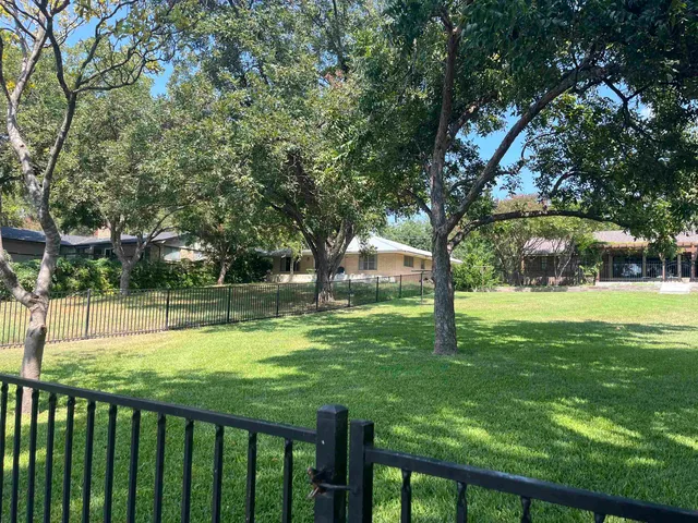 a bench sitting in front of a building