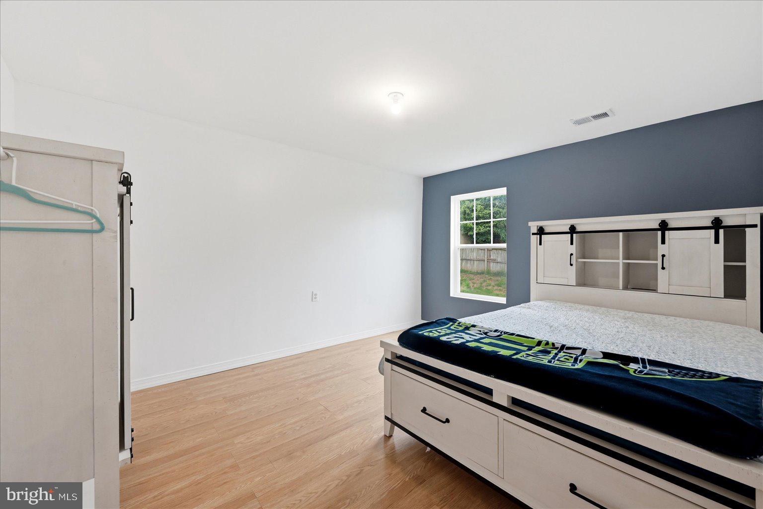 359 National Street Ranson, WV 25438 - Photo 46 of 58 a room with bed and wooden floor
