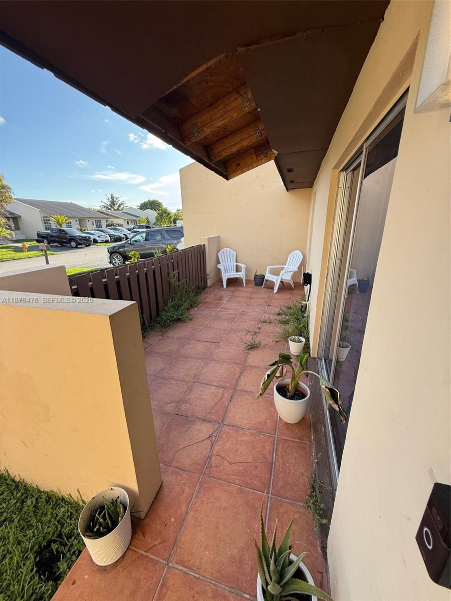 12413 Southwest 112th Terrace Miami, FL 33186 - Photo 11 of 16 a view of roof deck with table and chairs