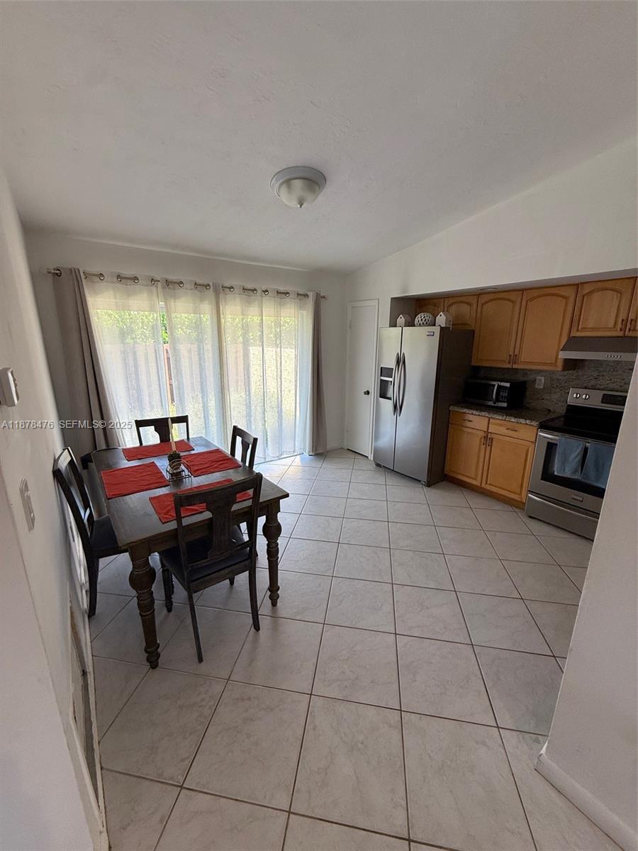 12413 Southwest 112th Terrace Miami, FL 33186 - Photo 4 of 16 a living room with furniture and a window