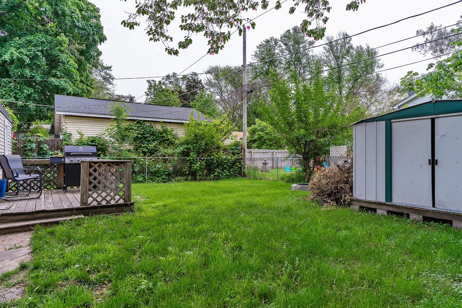 27 Arlington Road Fox Lake, IL 60020 - Photo 14 of 17 a view of a backyard with plants and a garden