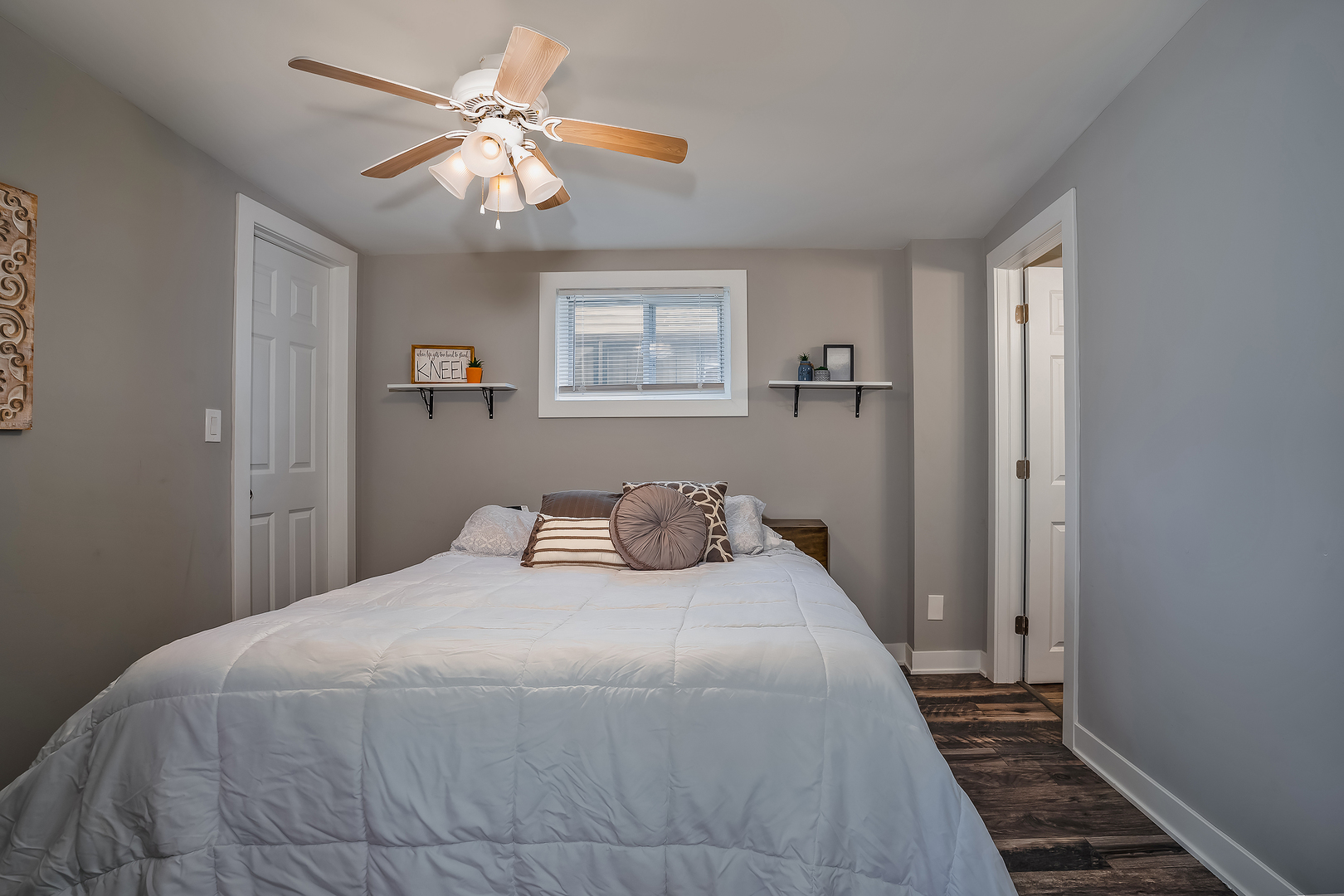 27 Arlington Road Fox Lake, IL 60020 - Photo 5 of 17 a bedroom with a large bed and a chandelier