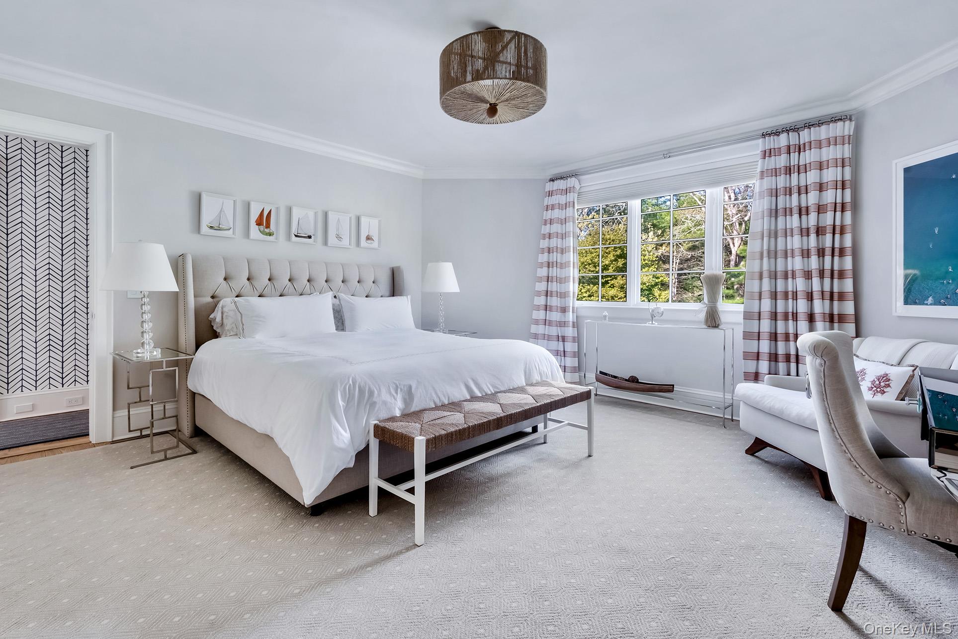 77 Jericho Road East Hampton, NY 11937 - Photo 15 of 31 a bedroom with a bed and a chair