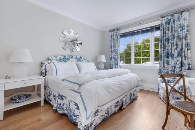 a bedroom with a bed and a table with chair