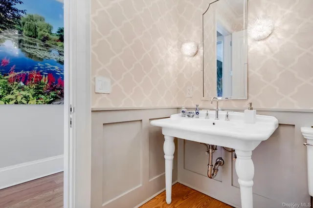 a bathroom with a sink and mirror