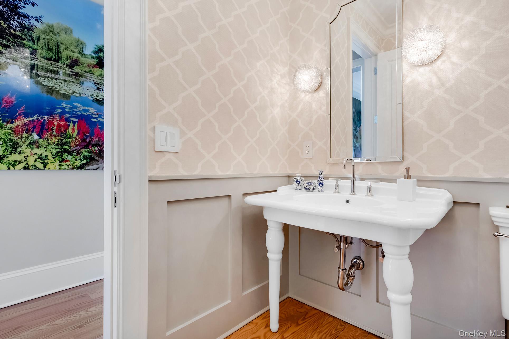 77 Jericho Road East Hampton, NY 11937 - Photo 6 of 31 a bathroom with a sink and mirror