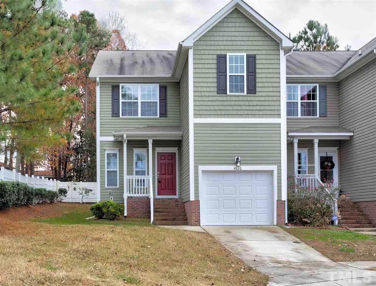 4630 Pat Reed Road Raleigh, NC 27616 - Photo 1 of 25 a view of a brick house with large windows and a yard