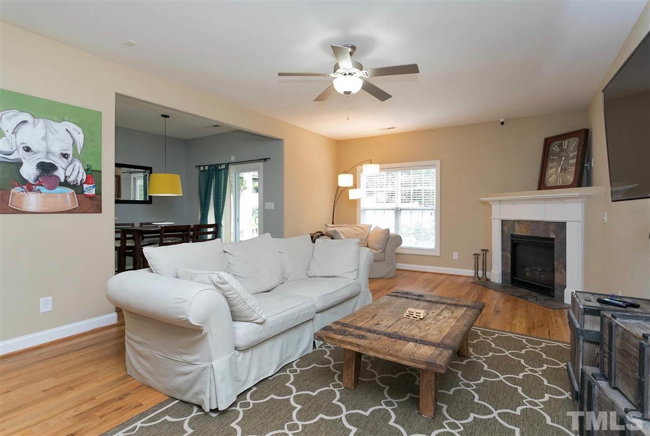 4630 Pat Reed Road Raleigh, NC 27616 - Photo 2 of 25 a living room with furniture and a fireplace