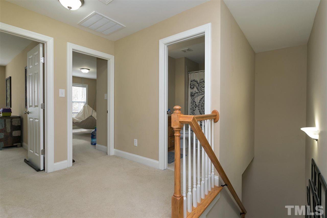 4630 Pat Reed Road Raleigh, NC 27616 - Photo 14 of 25 a view of a hallway with furniture and a livingroom