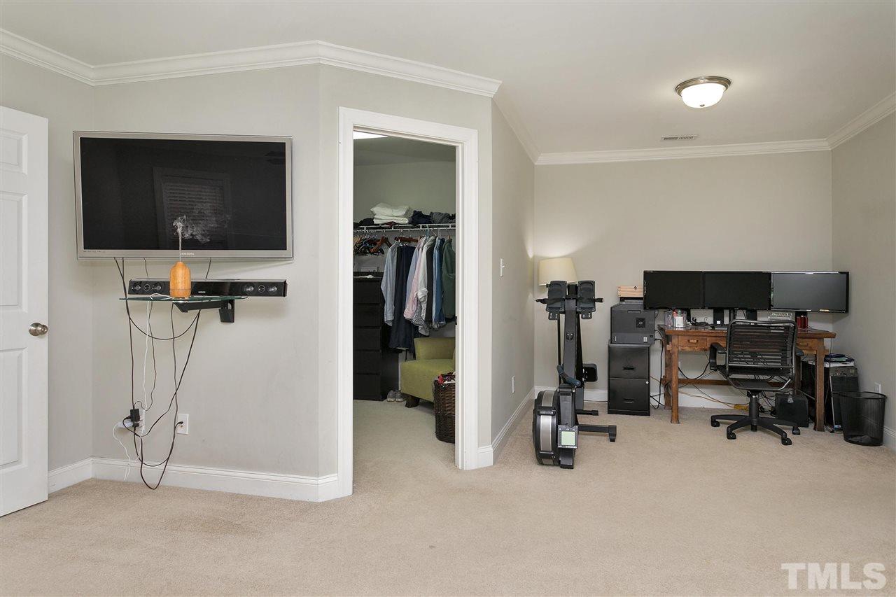 4630 Pat Reed Road Raleigh, NC 27616 - Photo 16 of 25 a view of a room with gym equipment