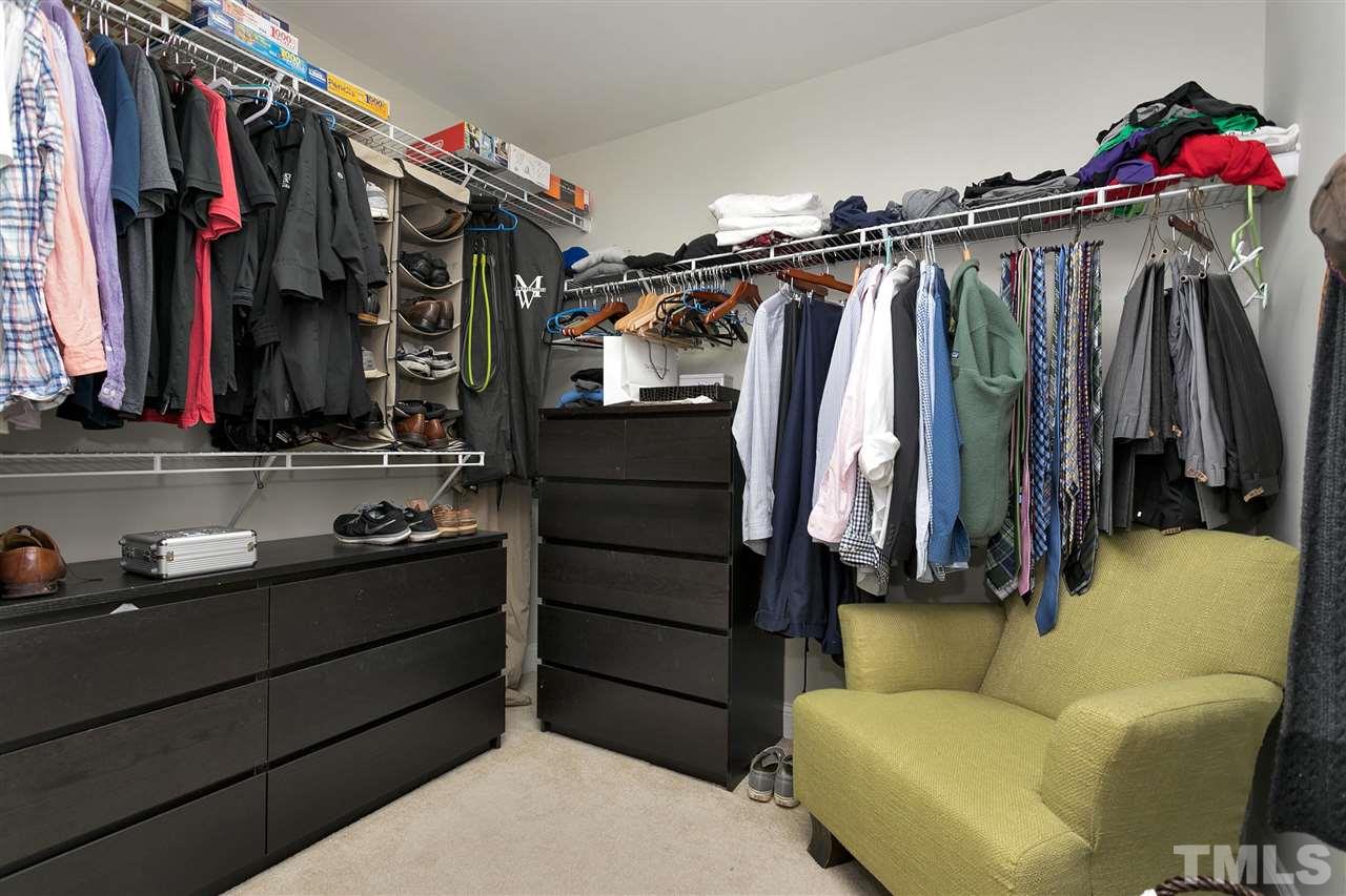 4630 Pat Reed Road Raleigh, NC 27616 - Photo 17 of 25 a view of walk in closet with clothes and shoes