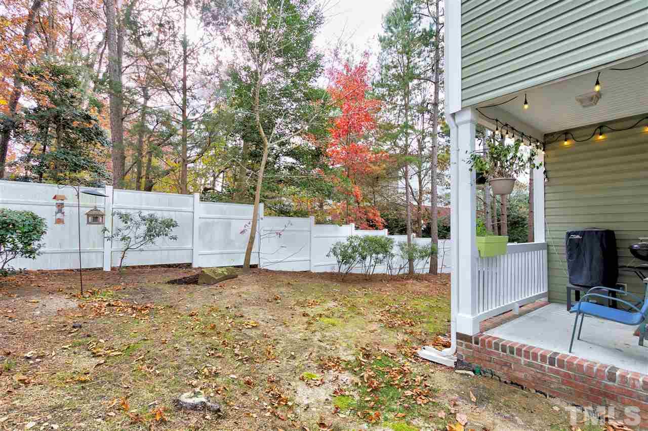 4630 Pat Reed Road Raleigh, NC 27616 - Photo 24 of 25 a backyard of a house with table and chairs
