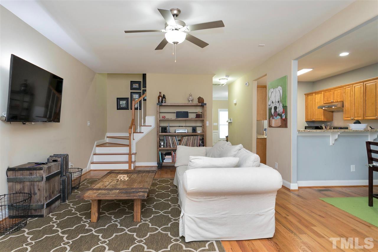 4630 Pat Reed Road Raleigh, NC 27616 - Photo 5 of 25 a living room with furniture and a flat screen tv