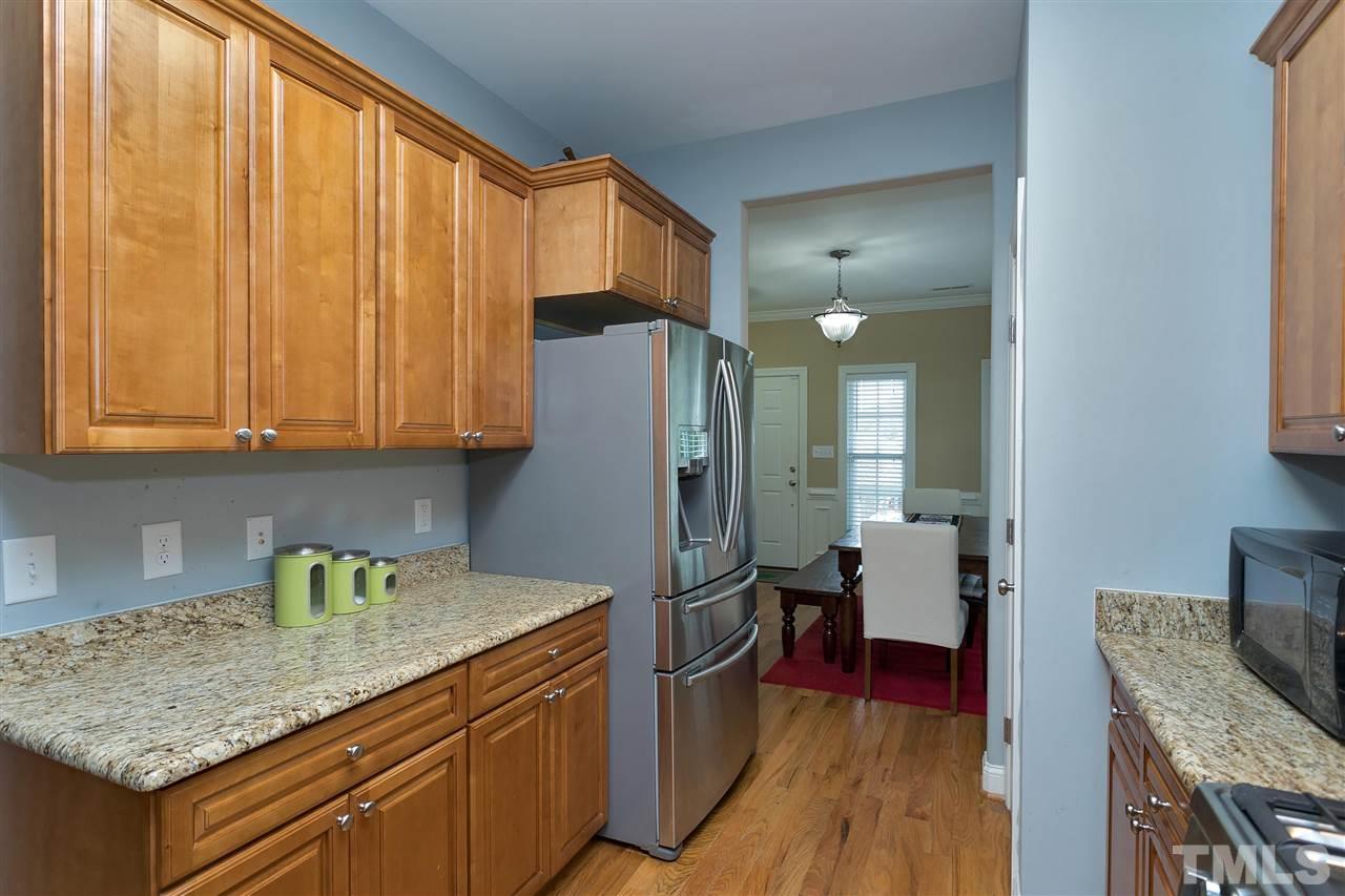 4630 Pat Reed Road Raleigh, NC 27616 - Photo 8 of 25 a kitchen with stainless steel appliances granite countertop a refrigerator and a sink
