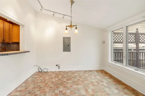 a view of an empty room with a window