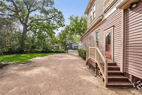 a house view with a sitting space and garden