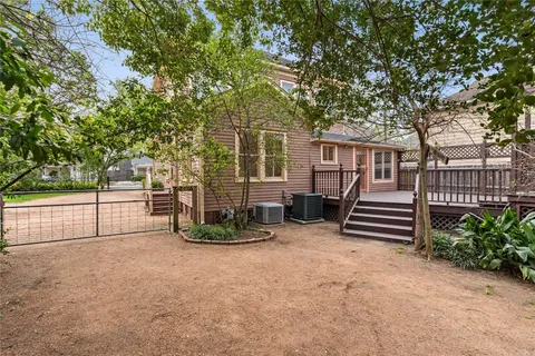 a balcony with wooden floor and fence