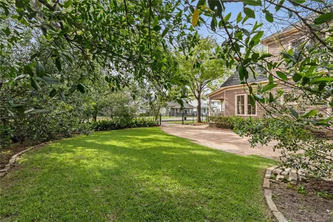 a front view of a house with iron fence