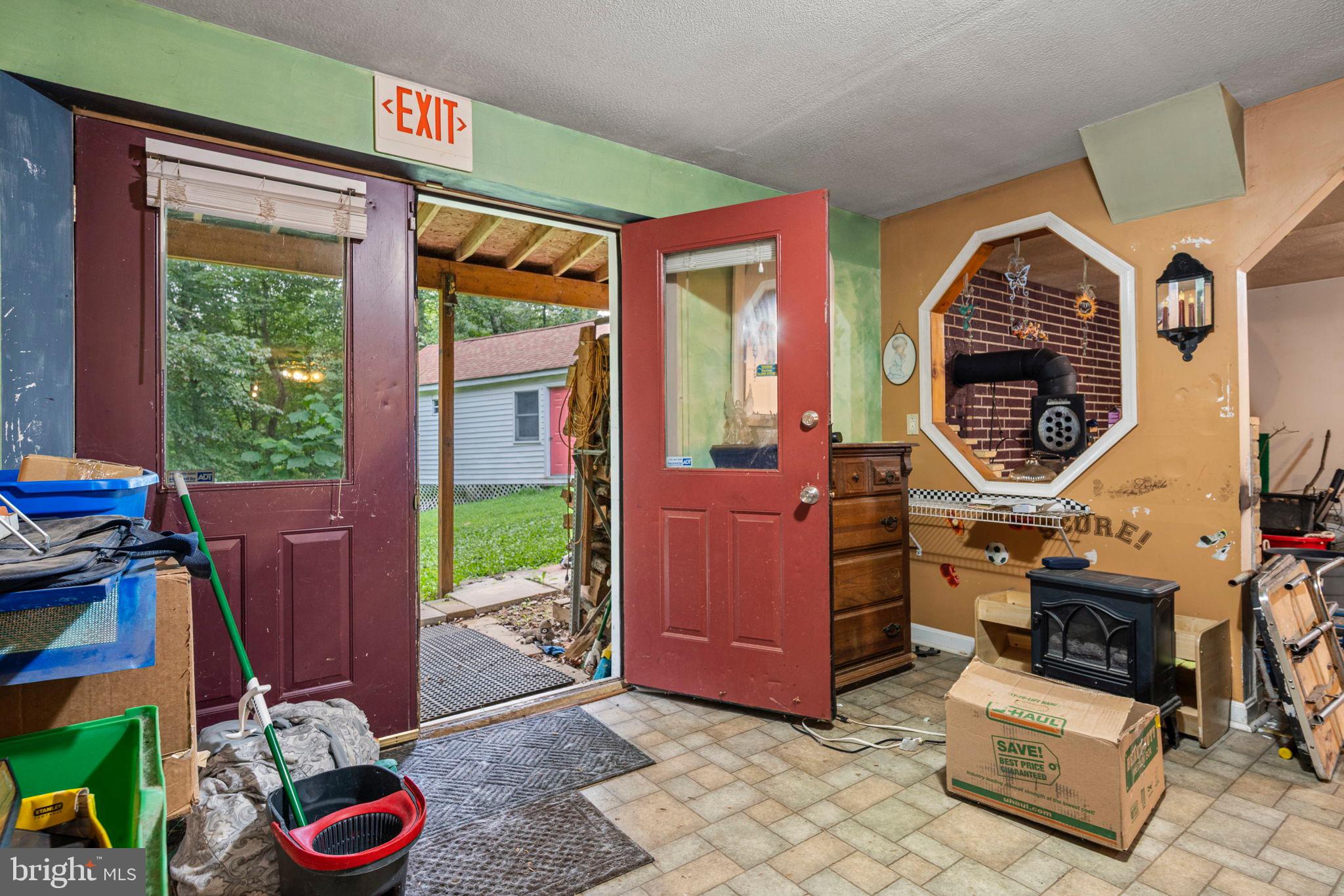 341 Goosemar Road Rising Sun, MD 21911 - Photo 16 of 24 a living room with furniture a window and a fireplace
