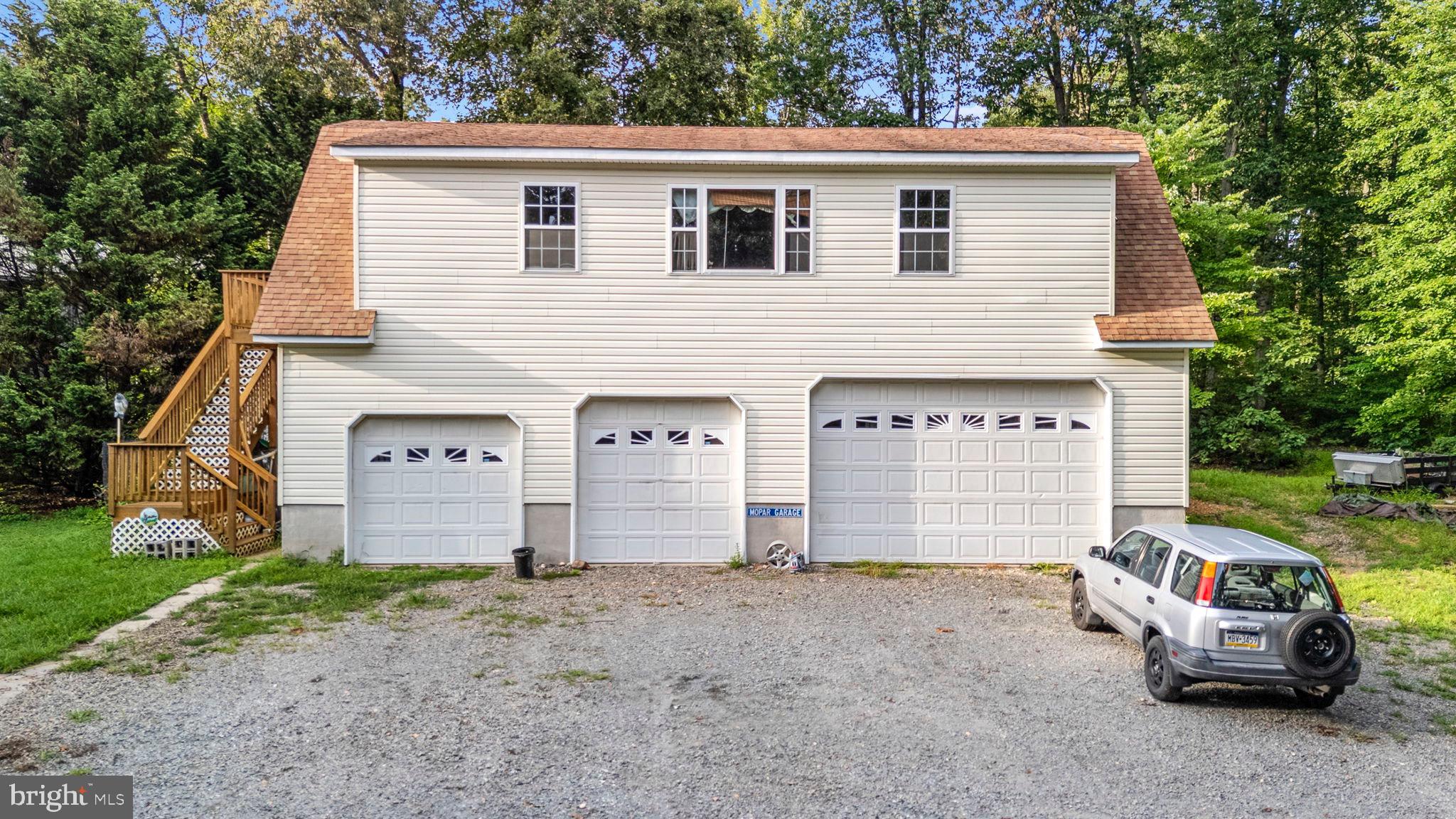 341 Goosemar Road Rising Sun, MD 21911 - Photo 19 of 24 a view of a house with a yard and garage