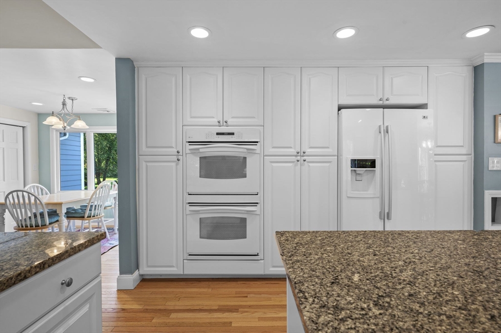 6 Beechwood Circle Boxford, MA 01921 - Photo 12 of 42 a kitchen with stainless steel appliances kitchen island granite countertop a refrigerator sink and cabinets