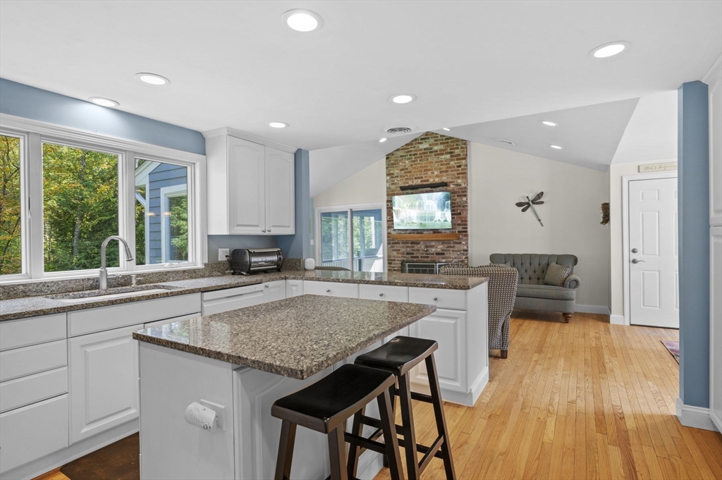 6 Beechwood Circle Boxford, MA 01921 - Photo 14 of 42 a kitchen with a table chairs sink and cabinets