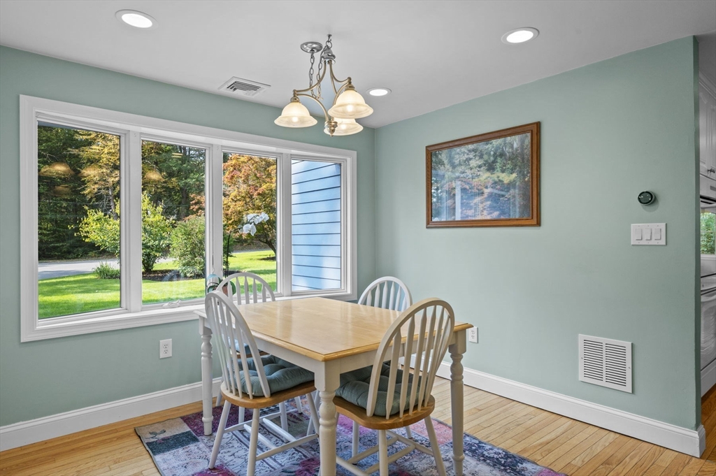 6 Beechwood Circle Boxford, MA 01921 - Photo 16 of 42 a view of a dining room with furniture wooden floor and chandelier