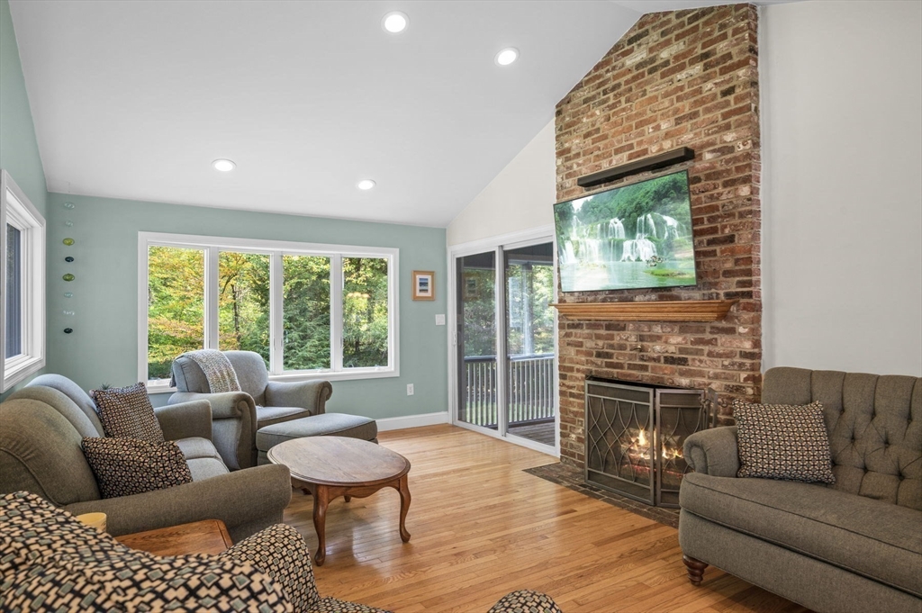 6 Beechwood Circle Boxford, MA 01921 - Photo 20 of 42 a living room with furniture and a fireplace