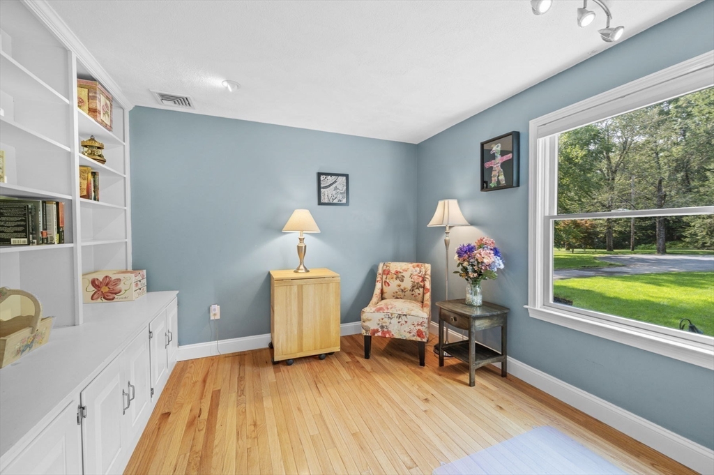 6 Beechwood Circle Boxford, MA 01921 - Photo 21 of 42 a living room with a window and a wooden floor
