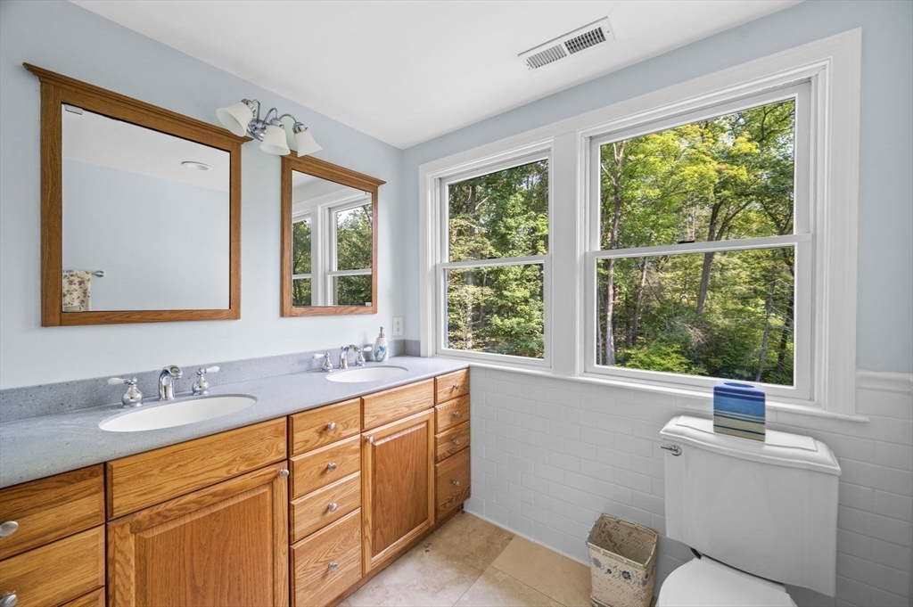 6 Beechwood Circle Boxford, MA 01921 - Photo 25 of 42 a bathroom with a sink mirror and a window