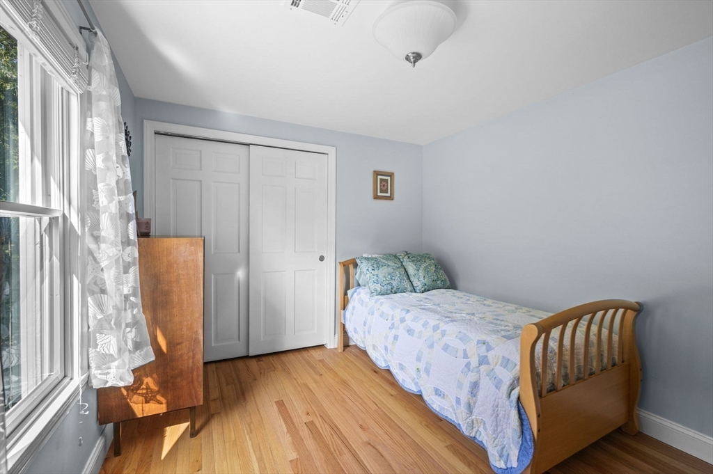6 Beechwood Circle Boxford, MA 01921 - Photo 27 of 42 a bedroom with a bed and wooden floor