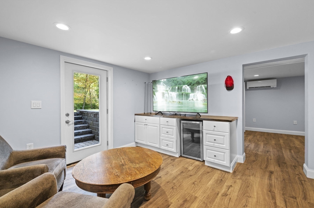6 Beechwood Circle Boxford, MA 01921 - Photo 37 of 42 a living room with furniture and a wooden floor