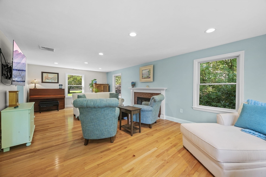 6 Beechwood Circle Boxford, MA 01921 - Photo 7 of 42 a living room with furniture a fireplace and a flat screen tv