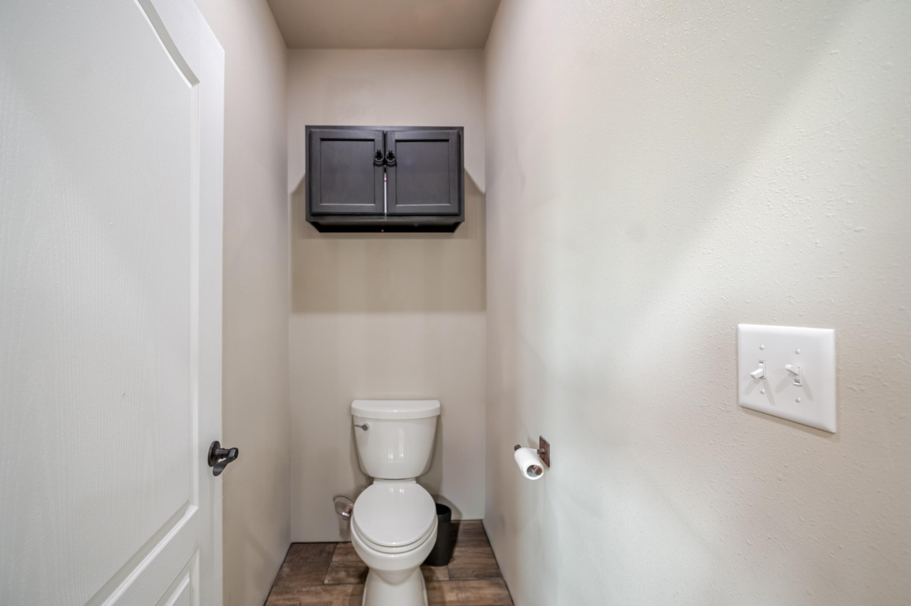 6792 Maine Road Anton, TX 79313 - Photo 21 of 77 a white toilet sitting next to a white wall