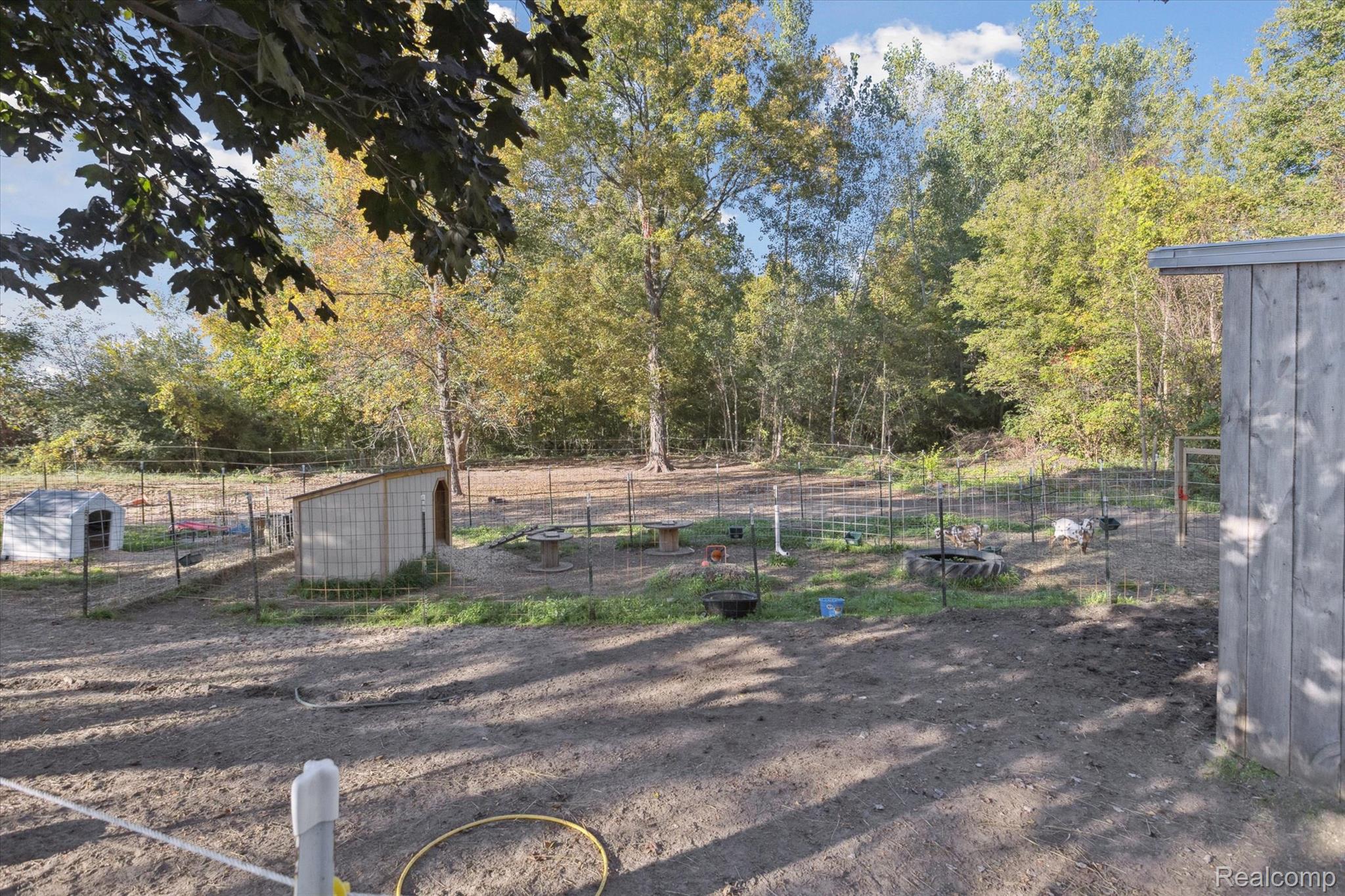 10147 South Bray Road Clio, MI 48420 - Photo 44 of 57 View of yard with an outbuilding