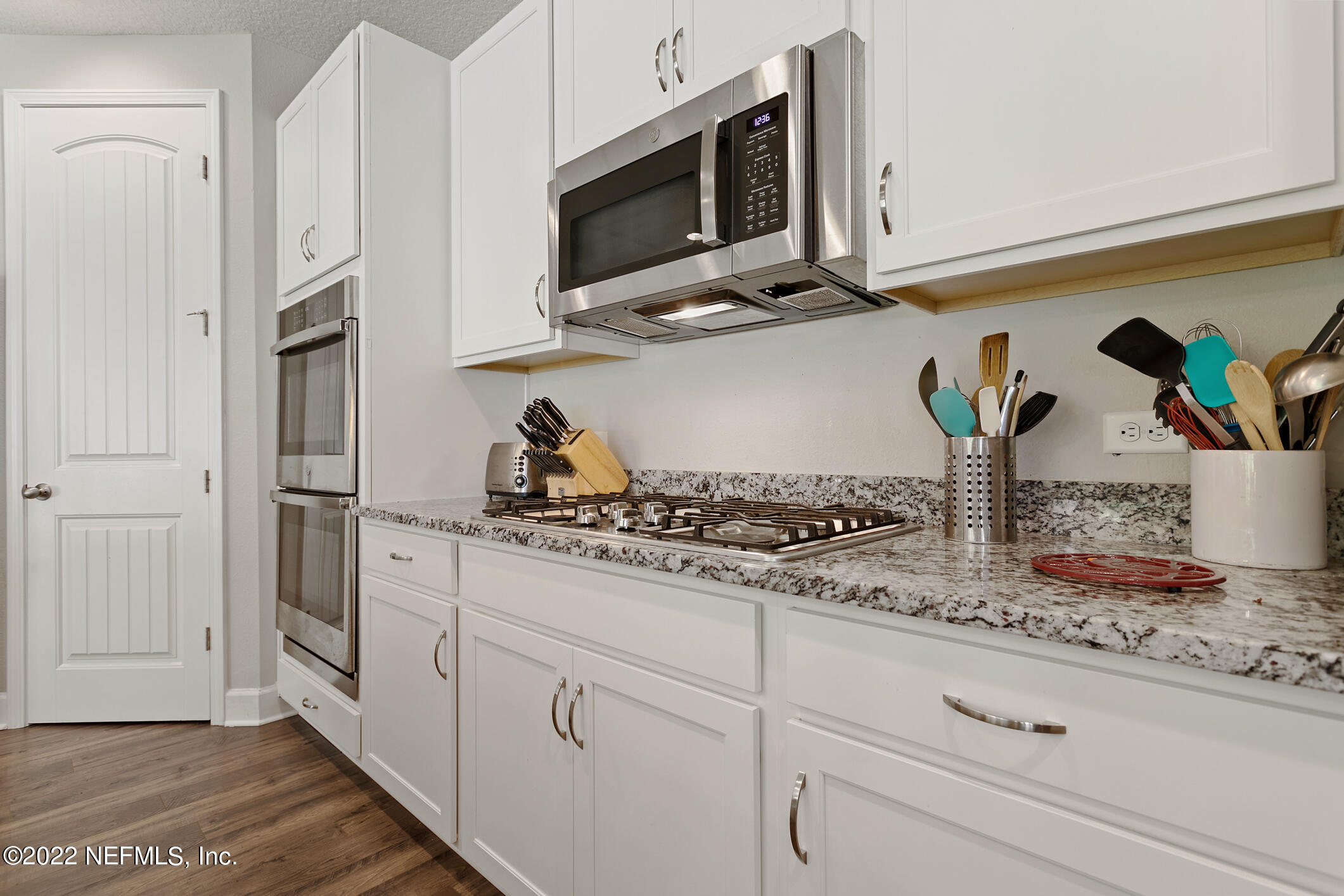 1098 Flach Drive St. Johns, FL 32259 - Photo 16 of 52 a kitchen with appliances cabinets and a counter top space