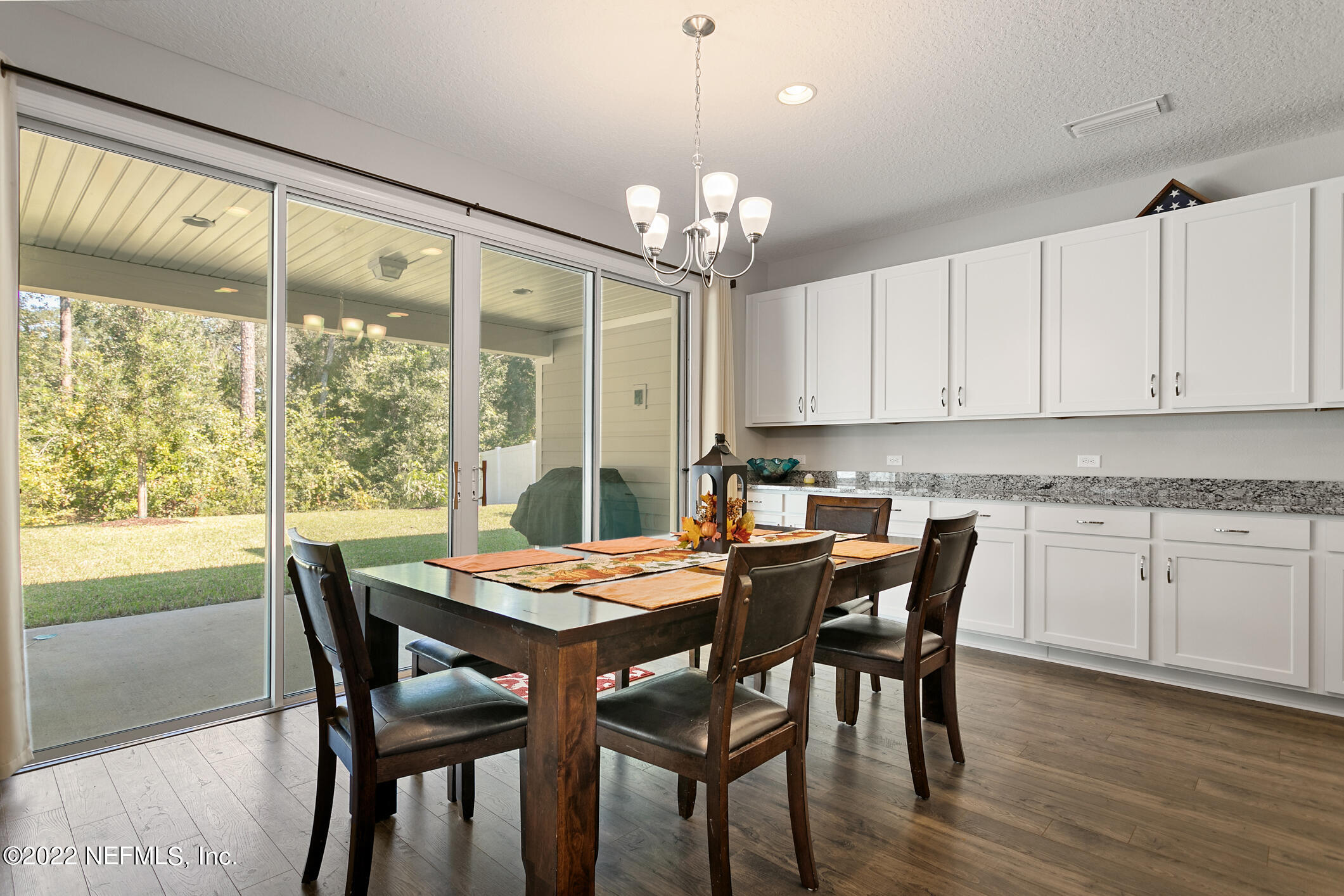 1098 Flach Drive St. Johns, FL 32259 - Photo 20 of 52 a view of a dining room with furniture window and wooden floor