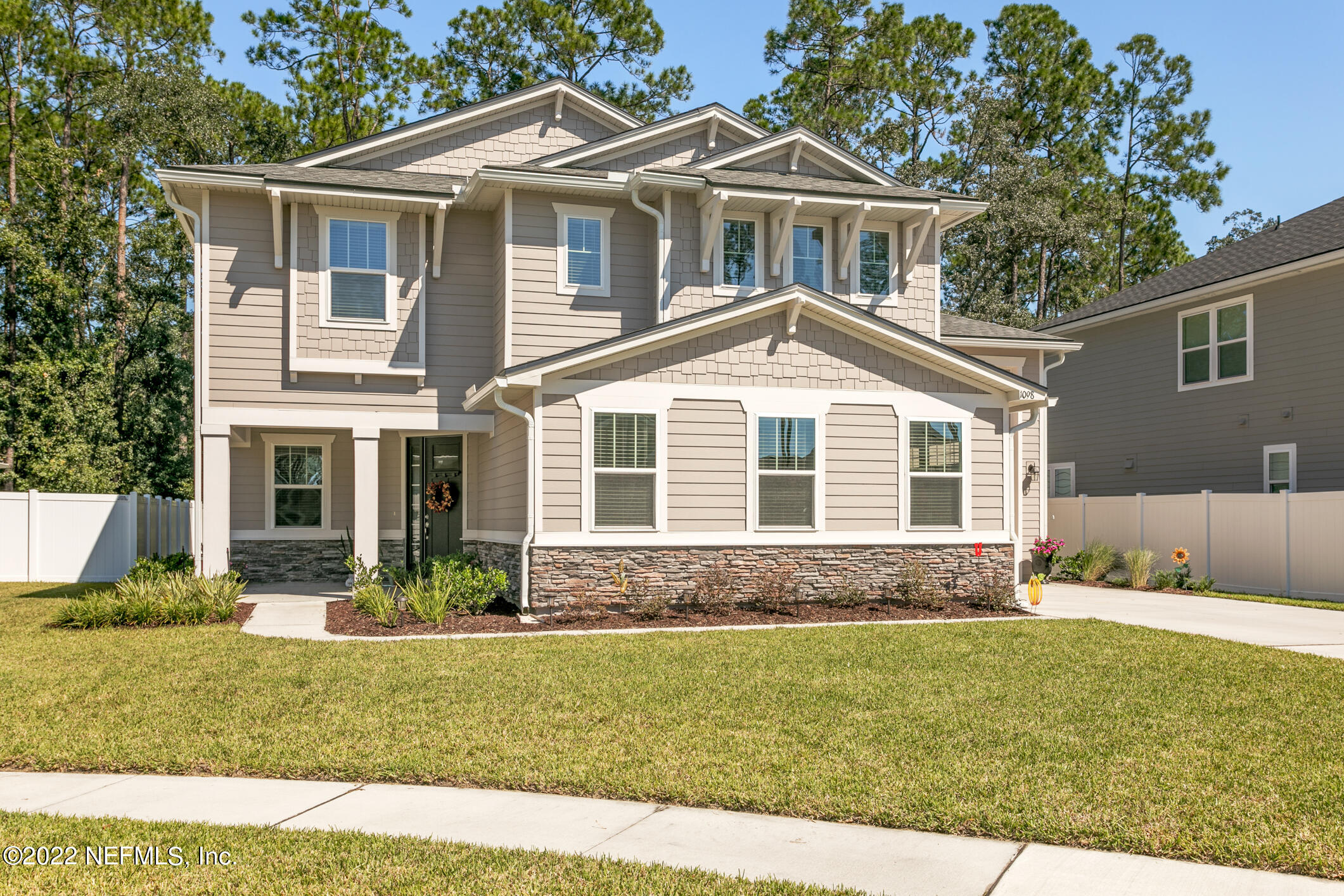 1098 Flach Drive St. Johns, FL 32259 - Photo 3 of 52 a front view of a house with a yard