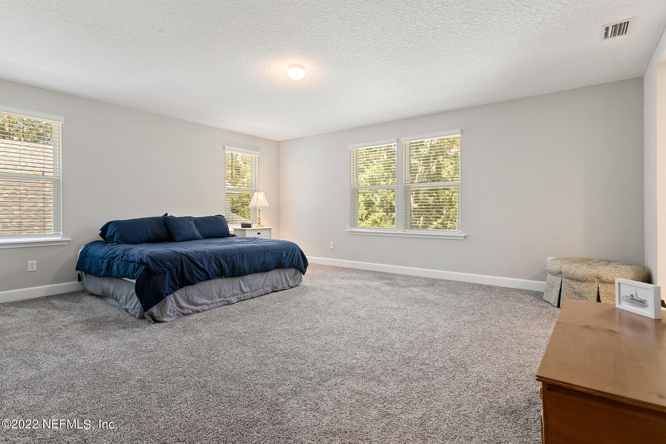 1098 Flach Drive St. Johns, FL 32259 - Photo 34 of 52 a spacious bedroom with a bed and a window