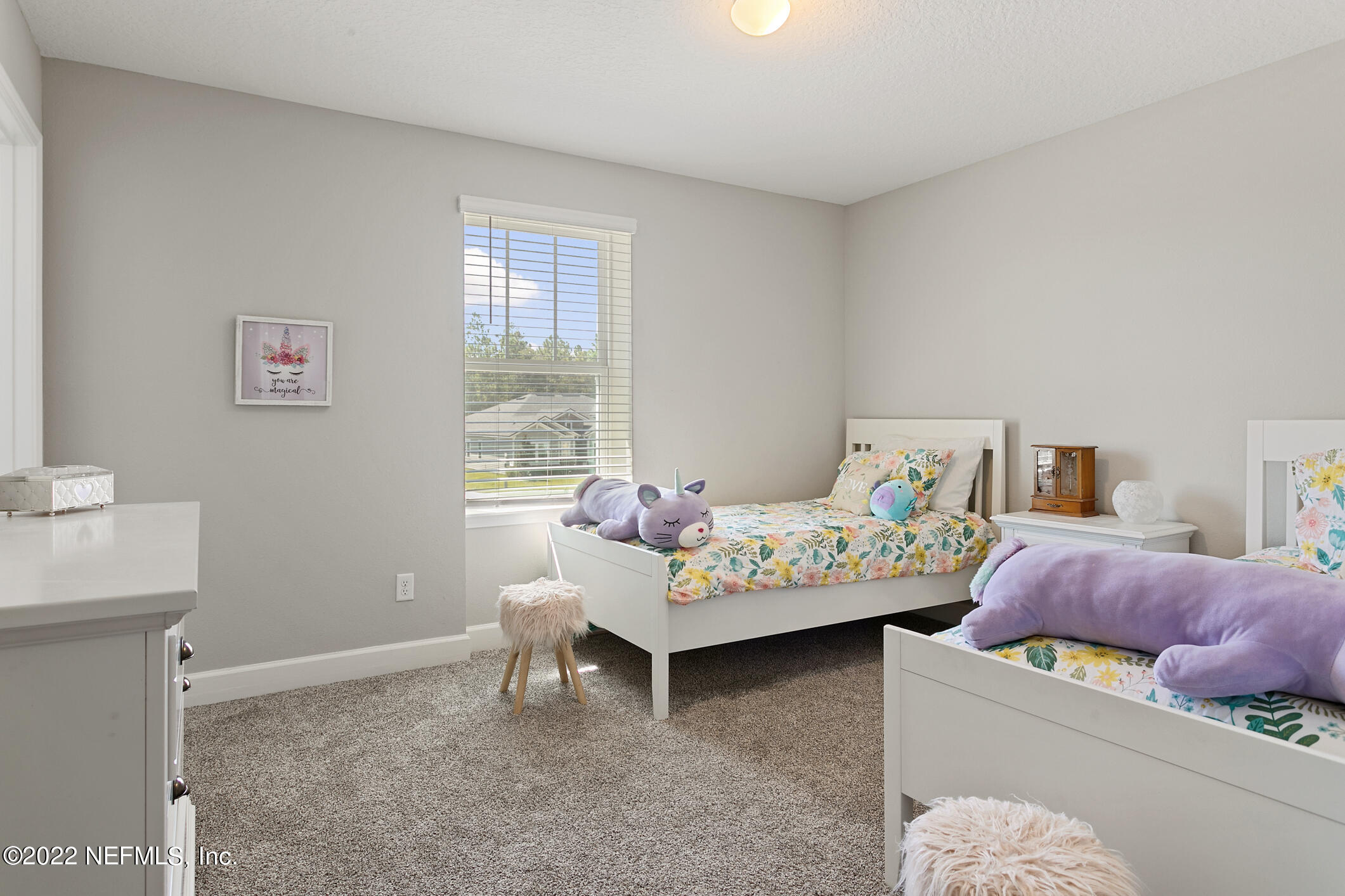 1098 Flach Drive St. Johns, FL 32259 - Photo 39 of 52 a bedroom with furniture and a window