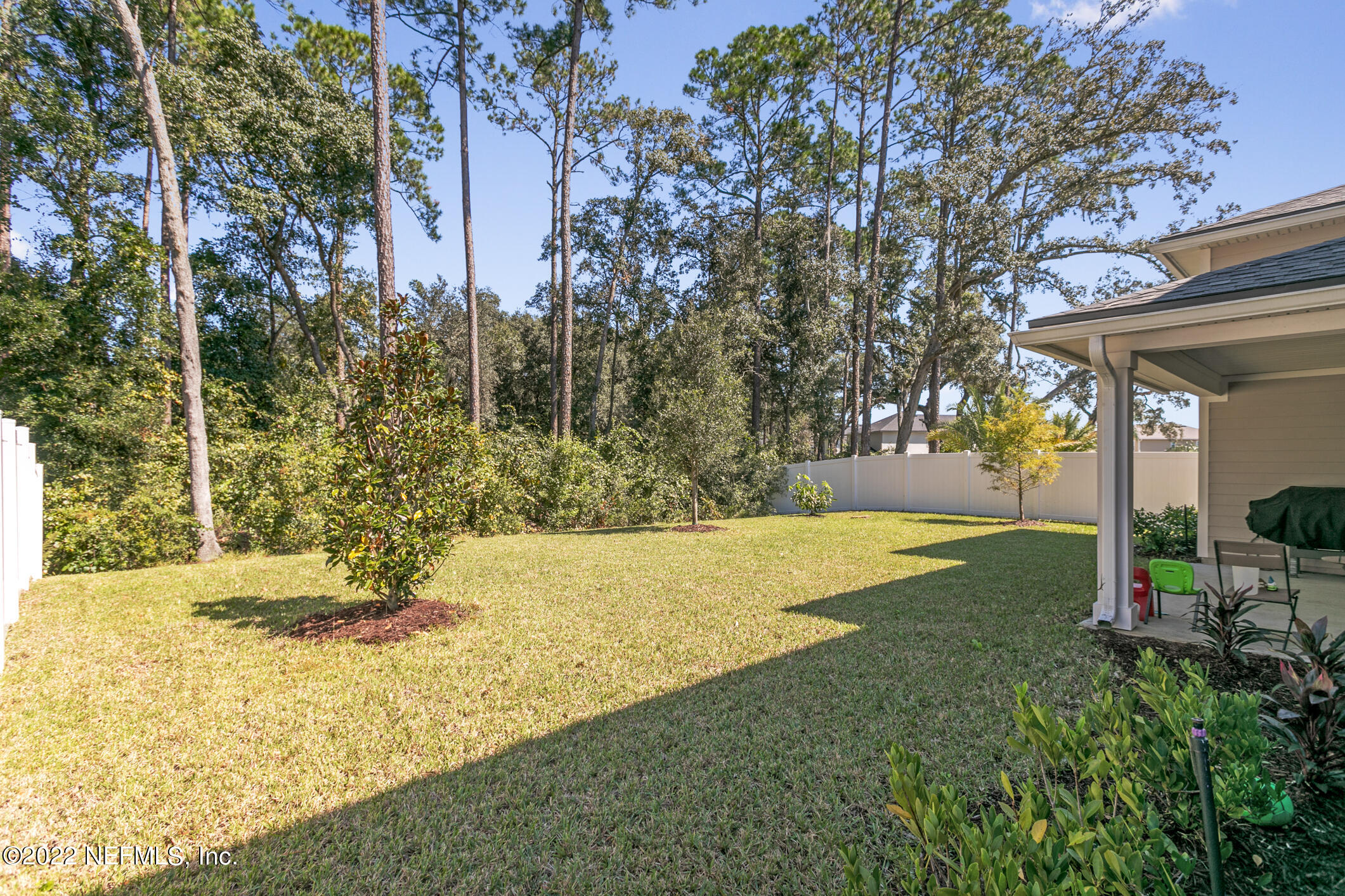 1098 Flach Drive St. Johns, FL 32259 - Photo 46 of 52 a view of a yard with plants and trees