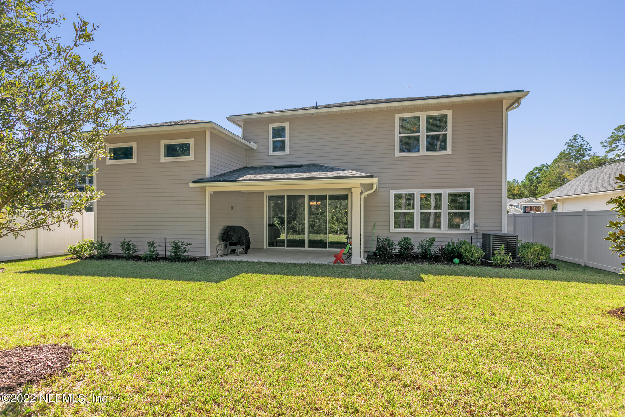 1098 Flach Drive St. Johns, FL 32259 - Photo 47 of 52 a view of a house with swimming pool and a yard