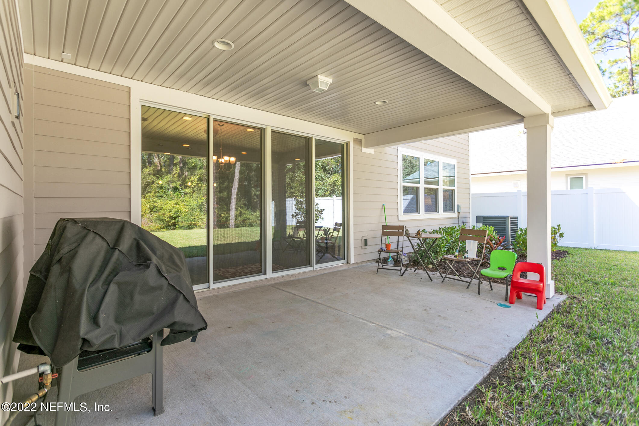 1098 Flach Drive St. Johns, FL 32259 - Photo 50 of 52 a bench sitting in front of a building
